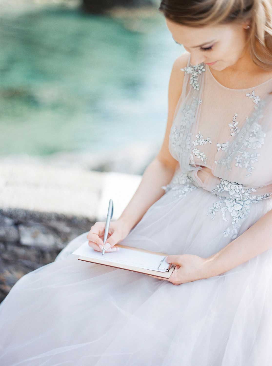 A bride writing in a notepad
