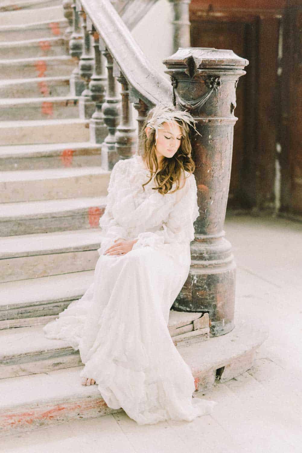A Bride sitting on a staircase
